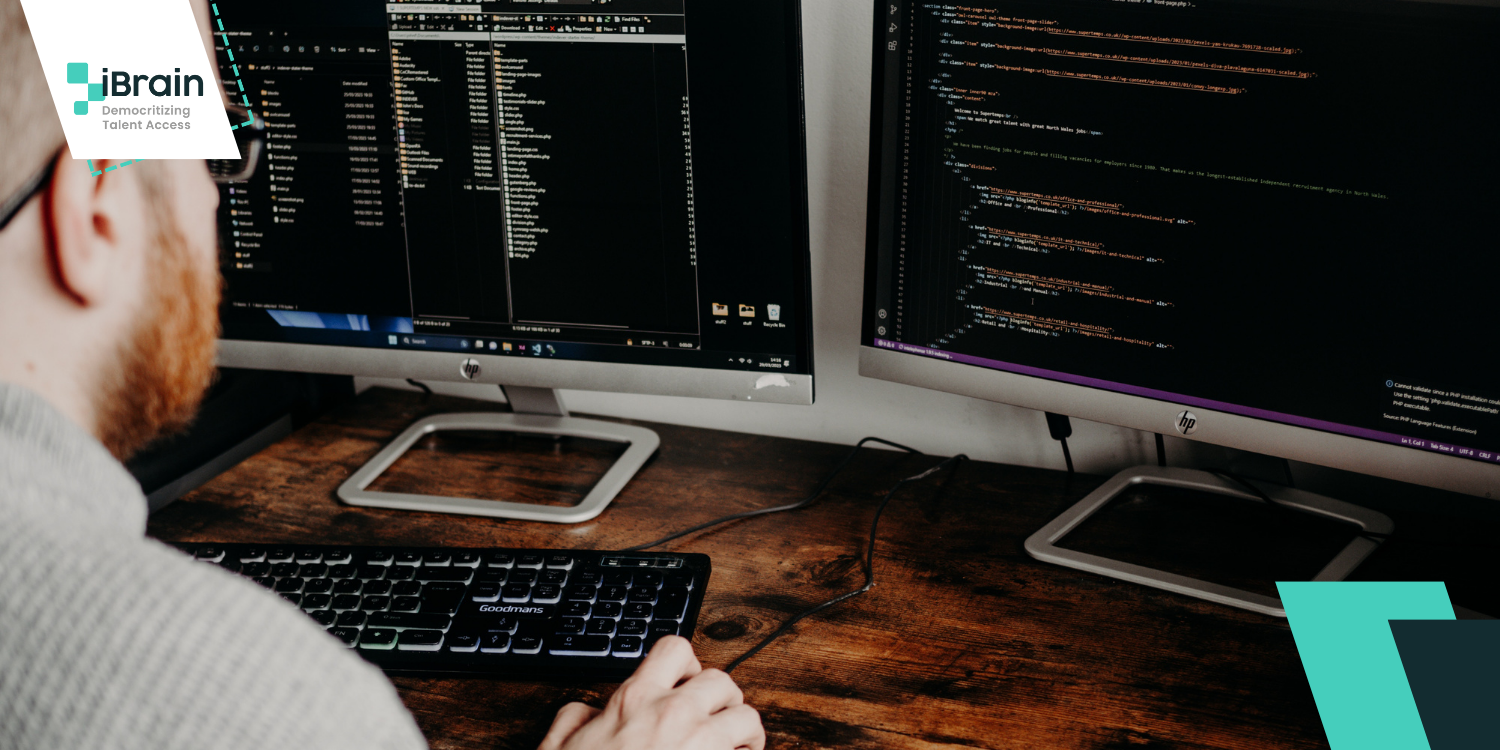 White bearded man coding