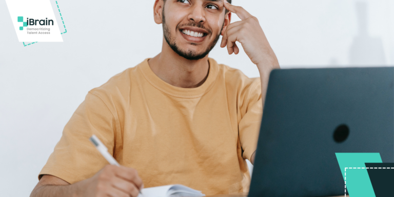 Title: What To Do Before an International Job Interview - Man using a laptop and taking notes