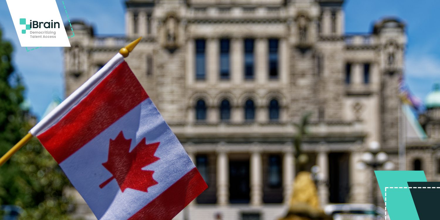 Canadian flag in front of the Toronto City Hall building.