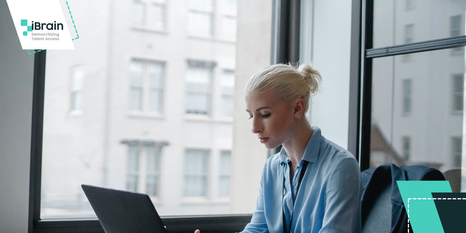 Corporate enviroment; Blonde woman using a computer